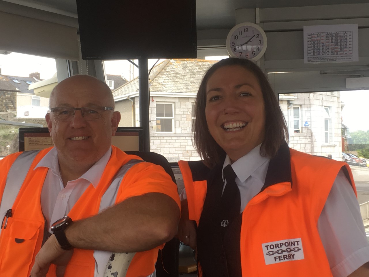 Two Torpoint Ferry employees posing for a photo