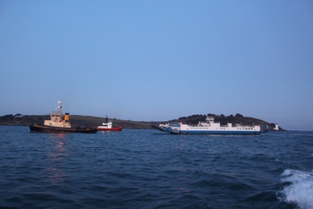 A photo of a Torpoint Ferry being pulled by a tug boat